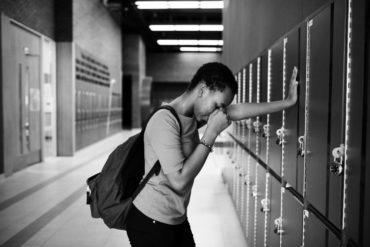 young sad student on the hallway PVGM3B5
