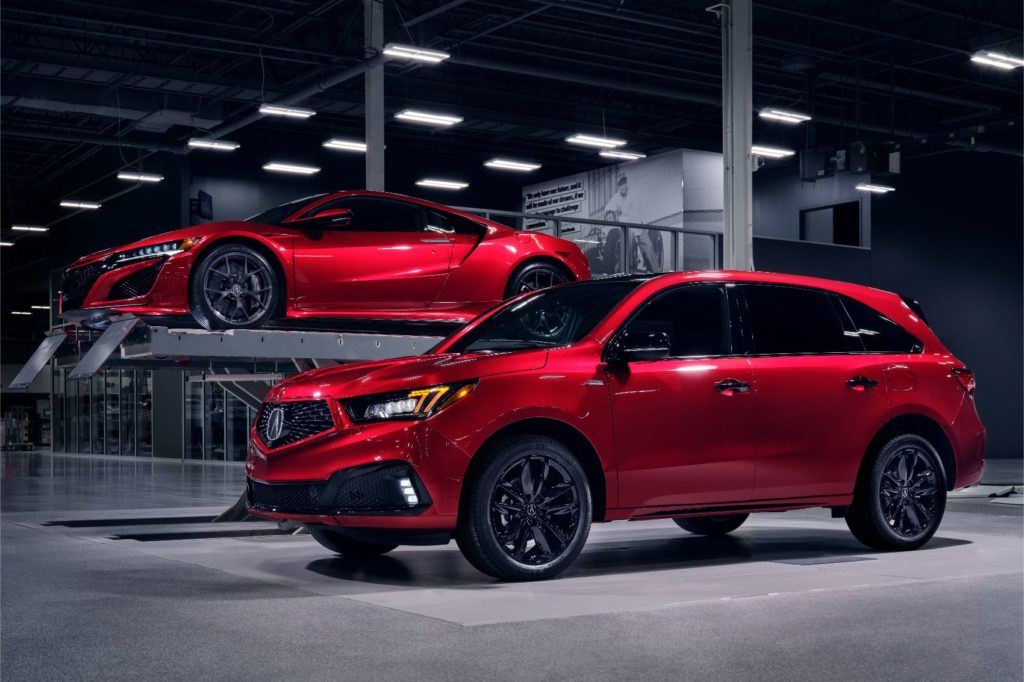 2020 Acura MDX PMC Edition in Valencia Red Pearl with the NSX in the background. 