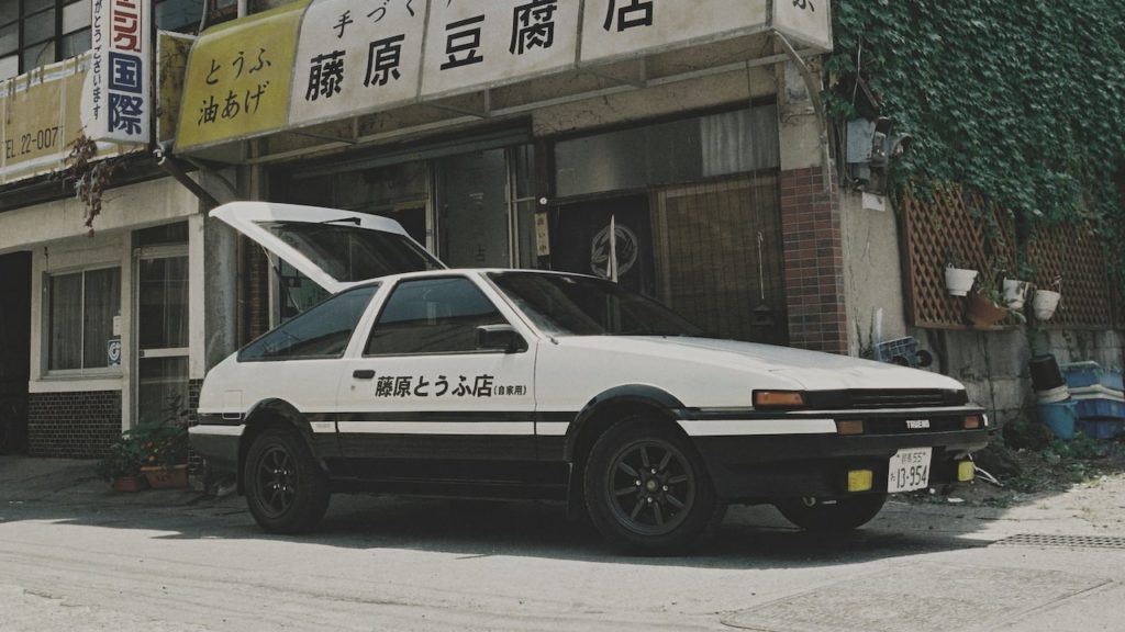 Takumi Fujiwara's AE86 in front of his father's tofu shop in Initial D.