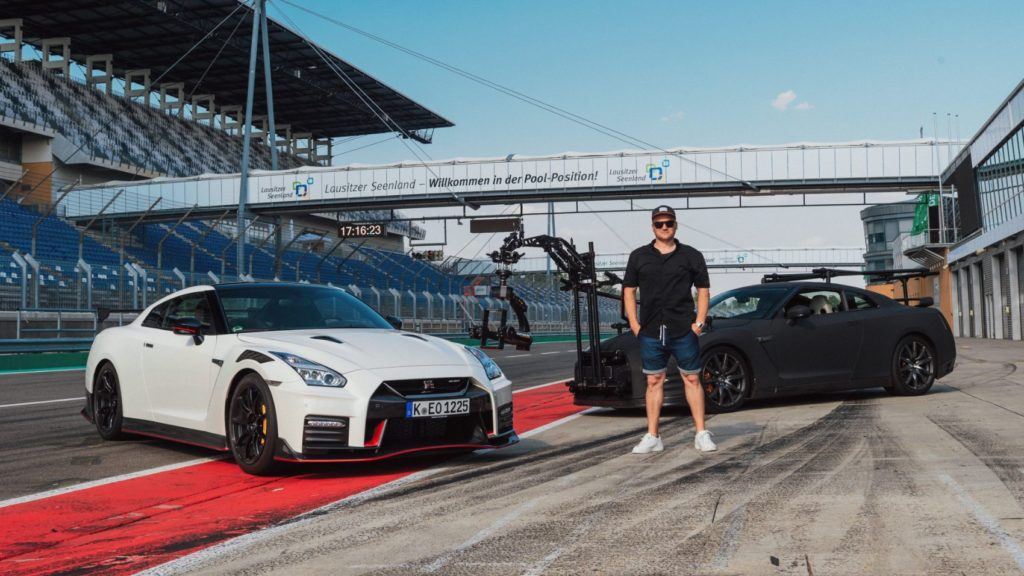 Mauro Calo with the Nissan GT-R Camera Car behind him.