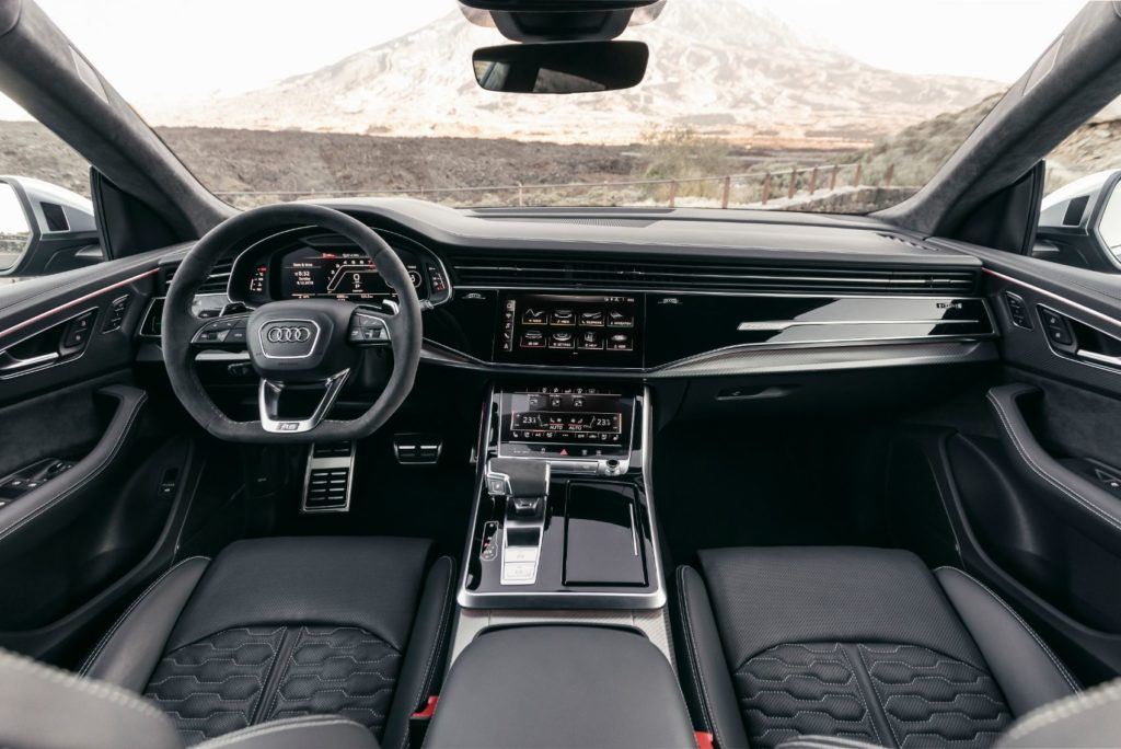 2020 Audi RS Q8 interior layout. The ventilated Valcona leather seats feature "RS" honeycomb stitching. A heated leather steering wheel, with large aluminum shift paddles, is also standard. 