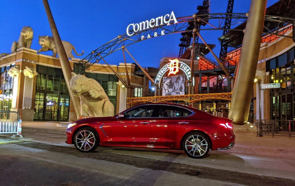 Our 2020 Genesis G70 Sport M/T (manual transmission) press vehicle outside of Comerica Park in downtown Detroit. The exterior paint is called Havana Red. Note the red Brembo brake calipers as well. 