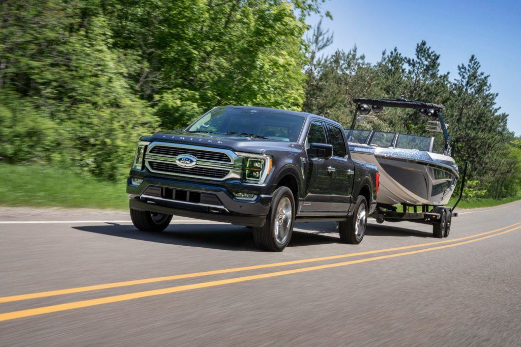 2021 Ford F-150 towing a boat. All 2021 Ford F-150 engines are mated to a 10-speed automatic transmission.  